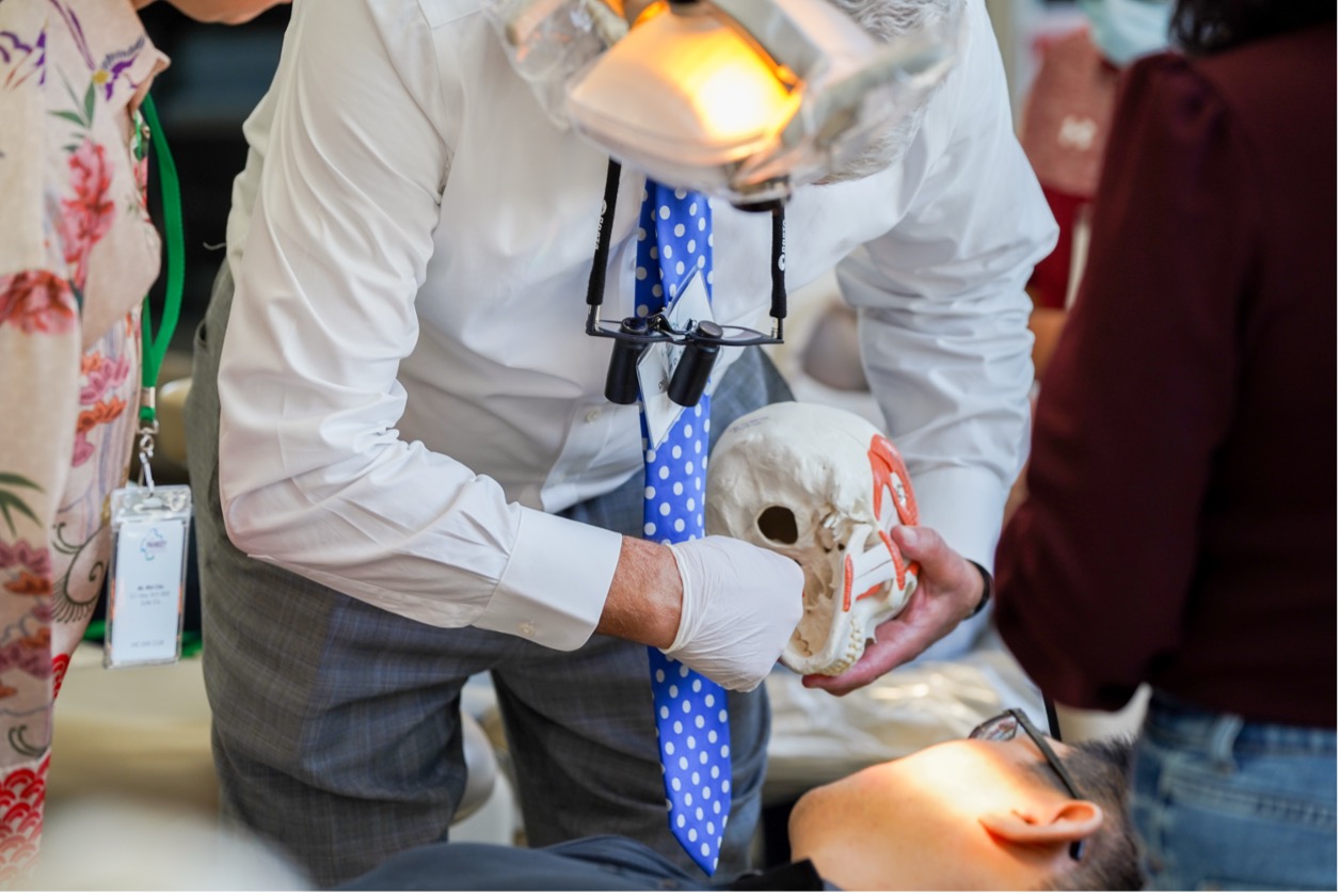 The image shows a faculty member at The Pankey Institute during Essentials 1, teaching young dentists dental practice leadership.